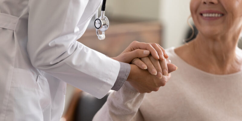 Doctor comforting cannabis patient