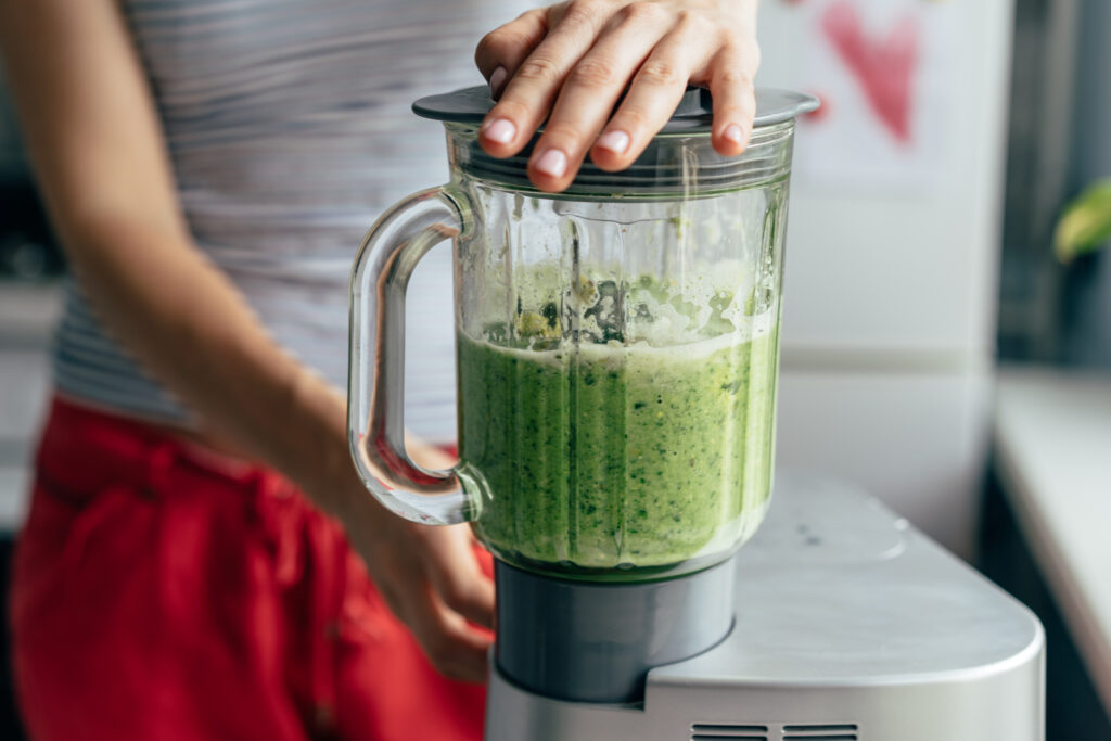 Blending a green cannabis spring smoothie Blending a green cannabis spring smoothie