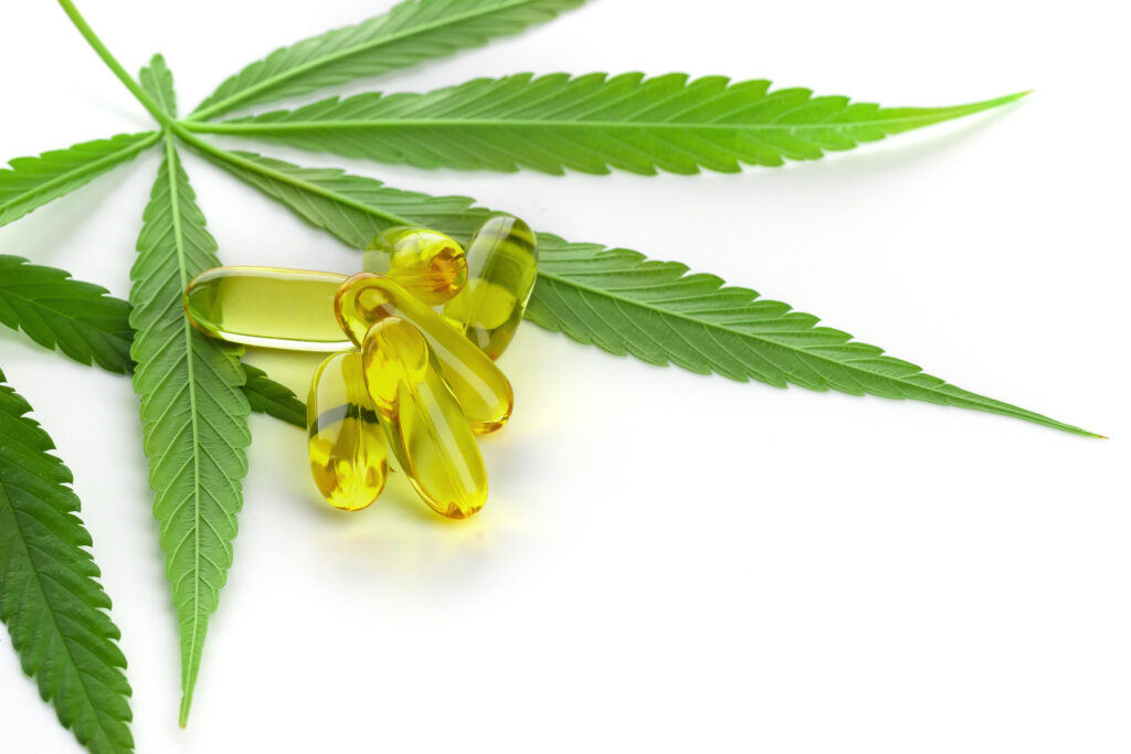 Cannabis essential oil Capsules with cannabis leaves