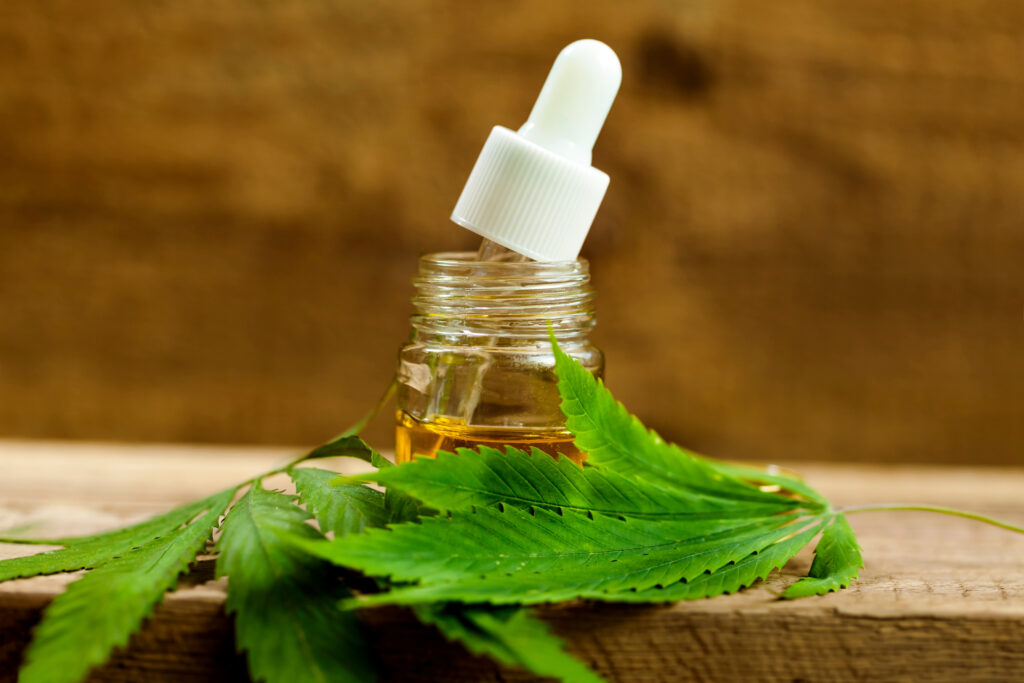 cannabis extract oil on a wooden table