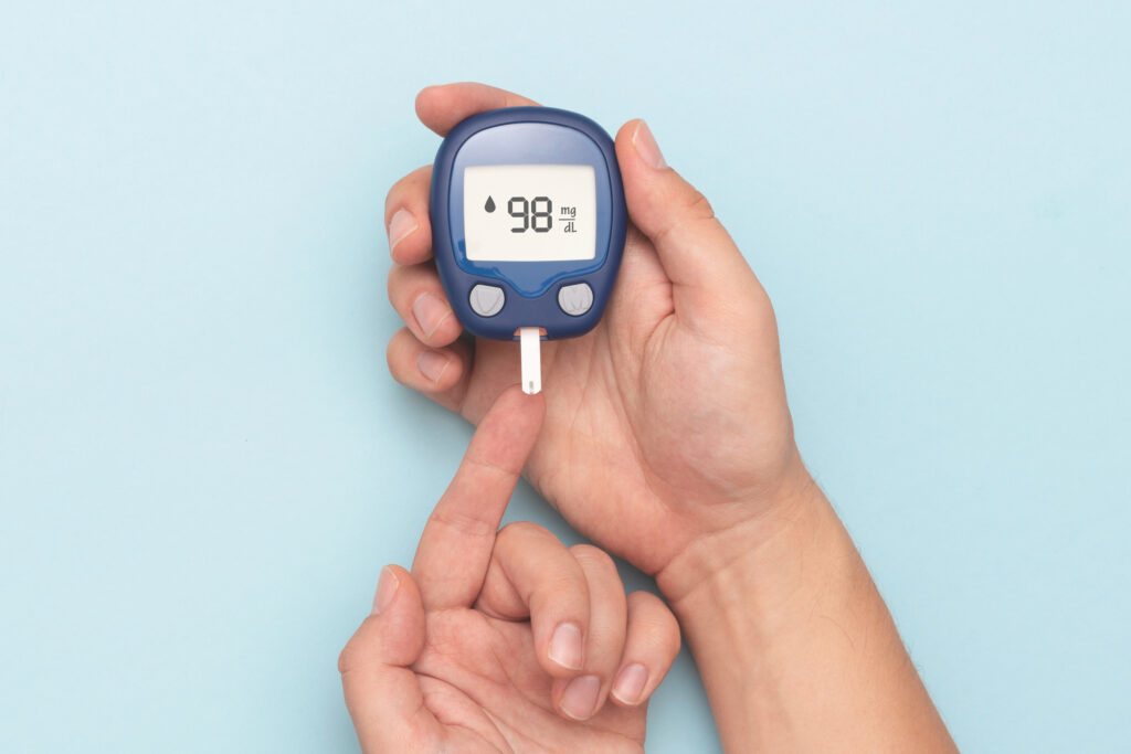 cannabis patient using glucometer, checking blood sugar level