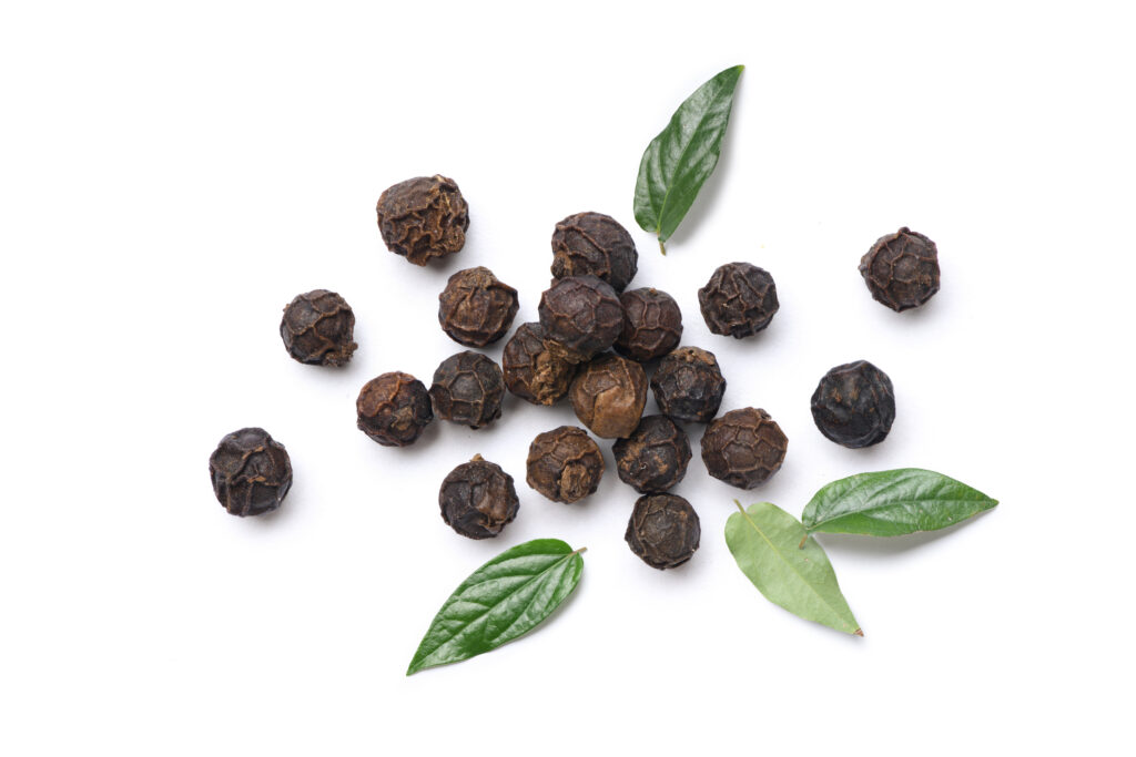 Flat lay of black peppercorns